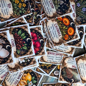 May include: A collection of square stickers featuring botanical illustrations and text labels including Rue, Catnip, Calendula, Clove, Egg Shell, Winter Savory, Oregano, and Lemon Peel. Each sticker has a decorative border and moon icons.
