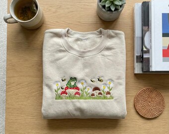Embroidered Frog Mushroom Sweatshirt, Cottagecore Aesthetic Hoodie, Toad on Toadstool Apparel, Nature Lover Gift, Whimsical Garden Top