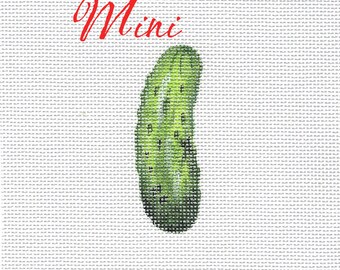 May include: A white background with the word "Mini" in red text and a green pickle in the center.
