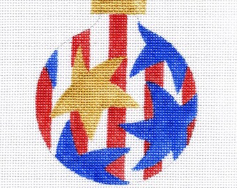 May include: A red, white, and blue Christmas ornament with a gold star and blue stars. The ornament is decorated with stripes and stars, reminiscent of the American flag. © WWW.JODYDESIGNS.COM