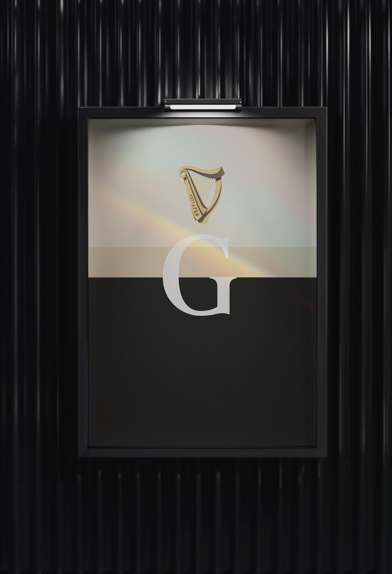 Minimalist art print inspired by Guinness branding, featuring a large letter G in black and cream tones, styled in a modern interior setting