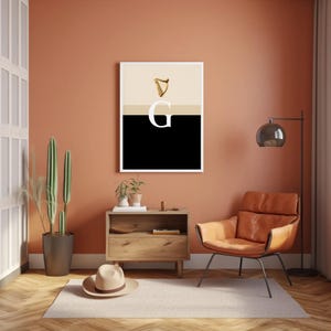 Minimalist art print inspired by Guinness branding, featuring a large letter G in black and cream tones, styled in a modern interior setting