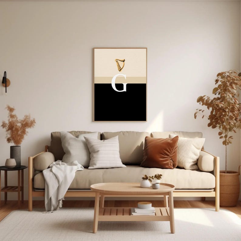 Minimalist art print inspired by Guinness branding, featuring a large letter G in black and cream tones, styled in a modern interior setting