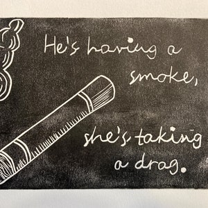 May include: Black and white illustration of a cigarette with smoke coming out of it. The text "He's having a smoke, she's taking a drag." is written on the image.