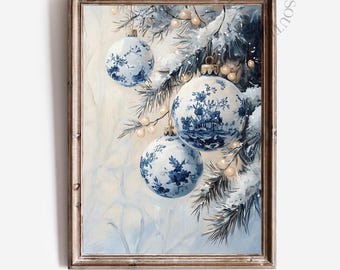May include: A framed print featuring three blue and white Christmas ornaments with floral and landscape designs. The ornaments hang from snow-covered evergreen branches, with small white lights and a soft, wintery background. The text "DANDEE SOUTH PRINTS" is at the bottom.