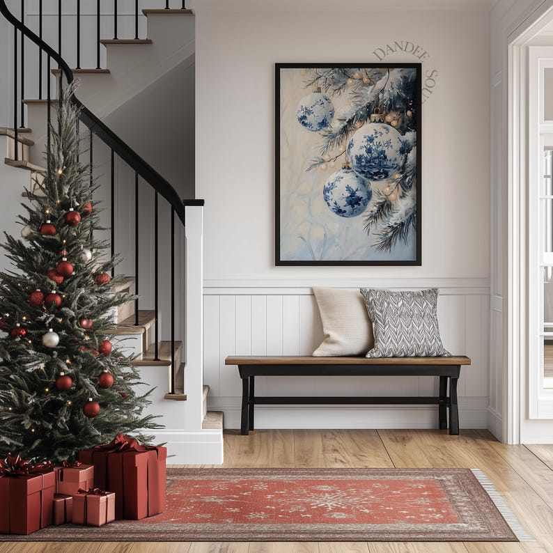 May include: A festive interior scene featuring a decorated Christmas tree with red ornaments and wrapped gifts. A framed artwork with blue and white Christmas ornaments hangs above a bench with pillows. A red rug adds warmth to the space.