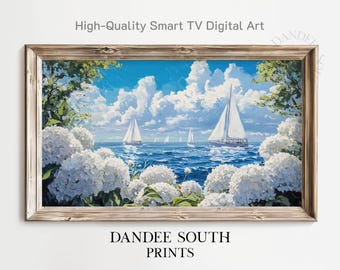 May include: A framed digital art print featuring a seascape with sailboats on a blue ocean under a cloudy sky. White hydrangeas frame the scene. The text "High-Quality Smart TV Digital Art" and "DANDEE SOUTH PRINTS" are visible.