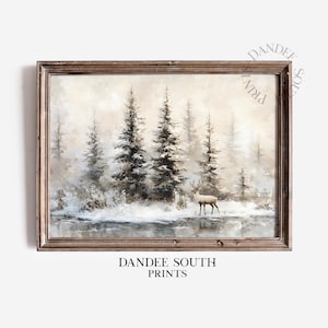 May include: A framed landscape print featuring a winter scene with tall evergreen trees and a deer standing near a body of water. The artwork has a muted color palette with a vintage aesthetic. The text "DANDEE SOUTH PRINTS" is at the bottom.