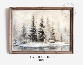 Puede incluir: Una impresión enmarcada de un paisaje invernal con altos árboles de hoja perenne y un ciervo cerca de una masa de agua. La obra de arte tiene una paleta de colores apagados con una estética vintage. El texto "DANDEE SOUTH PRINTS" está en la parte inferior.