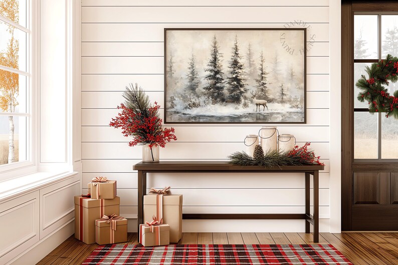 May include: A cozy interior scene featuring a dark wood console table adorned with festive decorations. A framed landscape painting hangs above the table. Wrapped gift boxes and a plaid rug add to the holiday ambiance. A wreath decorates the door.