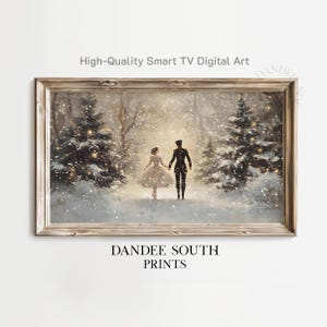 May include: A framed digital art print depicts a couple walking in a snowy forest. The artwork features a man in a black coat and a woman in a white dress, with text that reads "High-Quality Smart TV Digital Art" and "DANDEE SOUTH PRINTS."