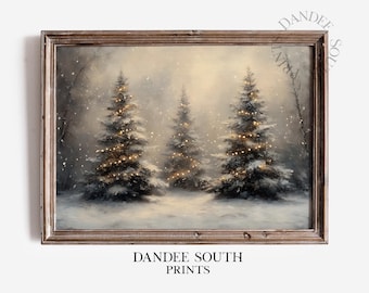 Puede incluir: Pintura enmarcada de un paisaje invernal con tres árboles de Navidad iluminados en un bosque nevado. La obra de arte tiene una estética vintage con iluminación suave y una paleta de colores apagados. El texto "DANDEE SOUTH PRINTS" está impreso en la parte inferior.
