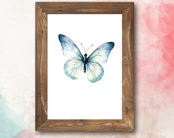 May include: A framed watercolor painting of a blue butterfly with white and light blue wings. The butterfly is centered in the frame and is the only subject in the image.