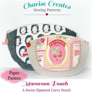 May include: A sewing pattern for a curved zippered pouch called a "Macaroon Pouch". The pattern features a pink and white fabric with a vintage-style fruit design and a blue and white fabric with a repeating pattern of women's faces. The text "A Sweet Zippered Curvy Pouch" is also included.
