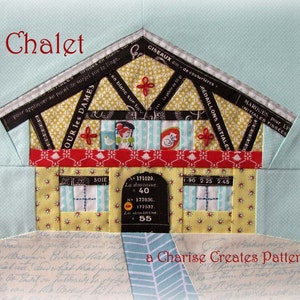 May include: A colorful patchwork quilt block depicting a chalet with a red roof, yellow walls, and a blue window. The block is surrounded by a light blue background with white polka dots. The text "Chalet" is written in red at the top of the block. The text "a Charise Creates Pattern" is written in black at the bottom of the block.