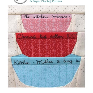 May include: A paper piecing pattern for a set of mixing bowls. The pattern includes three bowls, each with a different fabric design and a handwritten phrase. The top bowl is pink with the phrase "the kitchen. House." The middle bowl is red with the phrase "Cleaning tag cotton 100°". The bottom bowl is blue with the phrase "Kitchen. Mother is busy in".