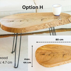 Solid wood couch table with live edge design, featuring waxed finish and industrial-style metal legs, ideal as a low-profile sofa side table.