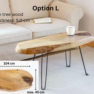 Rustic wood slab table handcrafted from one solid piece of ash timber, treated with natural wax for a stain-resistant surface and long-lasting use.