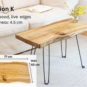 Rustic live edge table handcrafted from solid ash wood with natural knots and cracks. Finished with transparent Osmo TopOil for food safety, stain resistance, and durability. Stylish black hairpin or U-shaped legs add minimalist elegance. Perfect coffee or accent table for home décor.