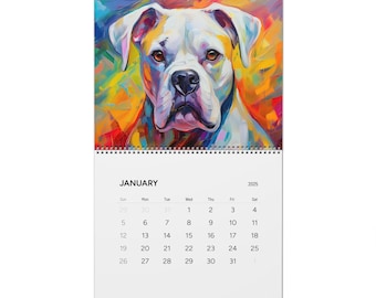Puede incluir: Un calendario colorido con un primer plano de la cara de un perro boxer blanco. El pelaje del perro está pintado en tonos de azul, verde, amarillo, naranja y rojo. El calendario es para el año 2025 y muestra el mes de enero.