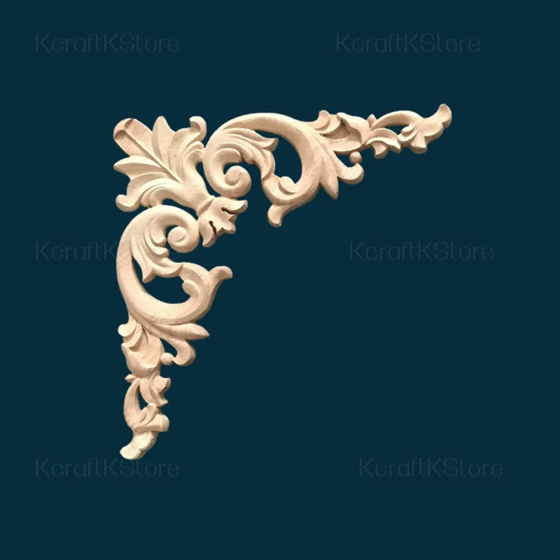 May include: A corner wood carving with an ornate, symmetrical design. The carving features swirling patterns, leaves, and floral elements. The unfinished wood has a light, natural color, and the piece is set against a dark teal background.