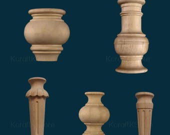 May include: Five unfinished wooden furniture legs in various shapes. The legs are light brown and appear to be turned on a lathe. The shapes include a vase-like design, a column, and a rounded shape. The background is a dark teal color.