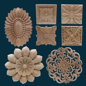 May include: Set of six wooden wall decor pieces featuring intricate floral designs. The pieces are carved from wood and have a natural finish. They are ideal for adding a touch of elegance to any room.