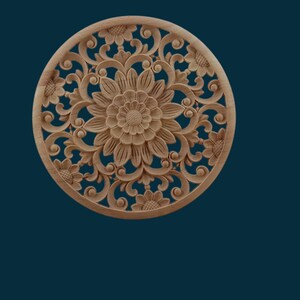 May include: A round, wooden wall decoration with intricate carvings of flowers and leaves. The design is symmetrical and features a large central flower with smaller flowers surrounding it.