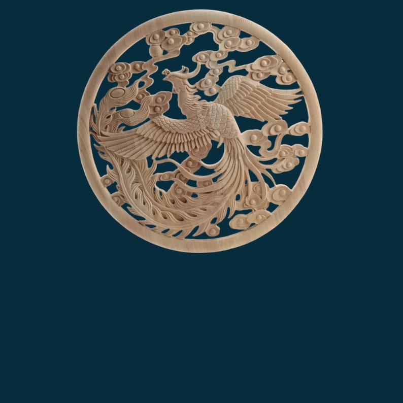 May include: A circular wooden carving of a phoenix with intricate details, surrounded by clouds. The carving is light brown in colour and has a smooth finish.