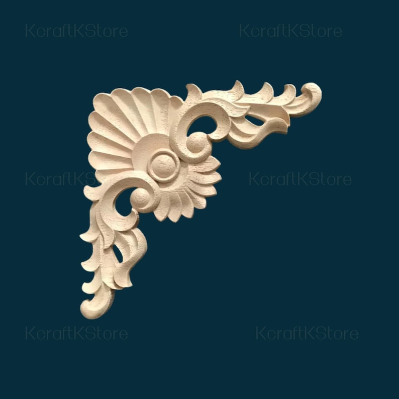 May include: A light-colored, wooden corner molding with an ornate, floral design. The molding features a fan-like element, swirling details, and a central circular design. The background is a dark teal color, and the text "KcraftKStore" is visible in the corners.