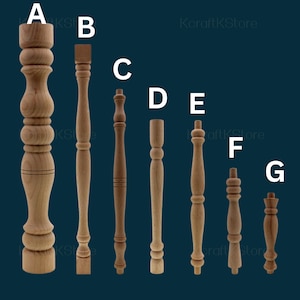May include: A collection of seven wooden furniture legs, each with a unique design. The legs vary in shape, from simple cylindrical forms to more ornate, turned designs. The wood has a natural, light brown color.
