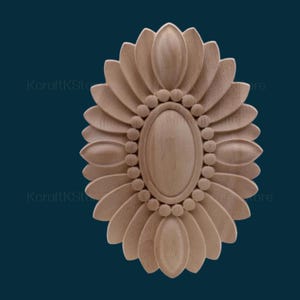May include: A wooden oval-shaped decorative accent with a carved floral design. The centre of the accent features a smaller oval with a beaded border.