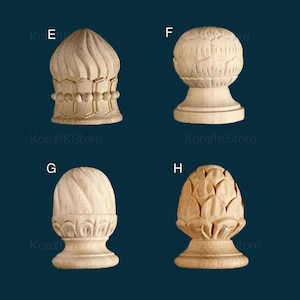 May include: Four different wooden finials, each with a unique carved design. The finials are displayed against a dark blue background. The designs include a fluted top, a sphere with leaf-like carvings, a smooth, rounded top, and a pinecone shape.