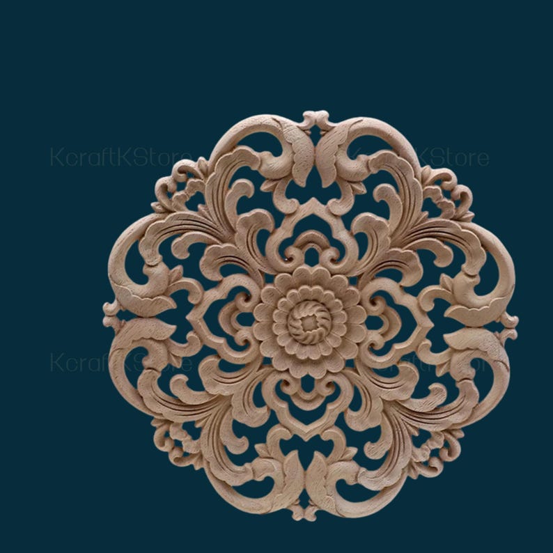 May include: A round, wooden wall decoration with intricate floral carvings. The design features a central flower with swirling petals and is surrounded by smaller, detailed floral motifs. The wood is a light brown colour.