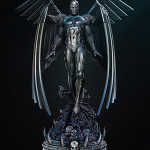 May include: A detailed statue of a figure with large, metallic wings, standing atop a base adorned with skulls and the word "Death". The figure is clad in a silver-grey suit, with a stern expression. The wings are a darker grey.
