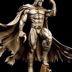 May include: A detailed statue of Moon Knight, a superhero, in a dynamic pose. The figure is predominantly white with gold accents, including crescent moon symbols. He wears a hooded cloak and holds crescent-shaped blades. The statue is on a gold base against a black background.
