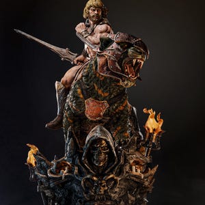 May include: A detailed statue of a muscular warrior riding a fierce, armored tiger. The warrior holds a sword, and the tiger has its mouth open, revealing sharp teeth. The base features a skull and candles, with torches on either side.