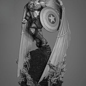 May include: A black and white figurine of a superhero with wings, holding a shield with a star on it. The figurine is standing on a base with a symbol on it.