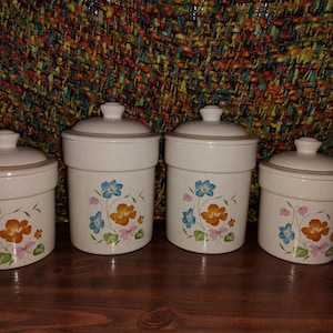 Vintage Treasure Craft ceramic canisters. 8 piece set. Farmhouse Floral Design.