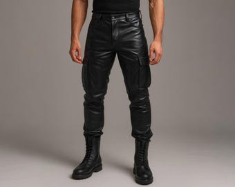 May include: Black leather cargo pants with two pockets on each leg. The pants have a fitted design and are paired with black combat boots. The model is wearing a black top. The background is a solid gray.