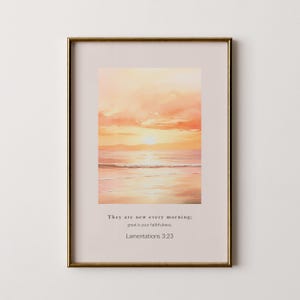 May include: Framed watercolor print of a sunset over the ocean, with warm orange and pink hues. The print includes the text "They are new every morning; great is your faithfulness. Lamentations 3:23."