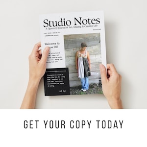 May include: A magazine titled Studio Notes, A Quarterly Journal of Art, Making & Creative Life, Fall 2026, Issue 001, A Sense of Place. The cover features a person wearing a patchwork dress and blue jeans standing against a wooden wall background.