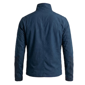 May include: A dark blue jacket shown from the back, featuring a high collar, long sleeves with reinforced elbow patches, and a structured back panel design. The garment is made of a solid-colored fabric with visible seams and a straight hemline.