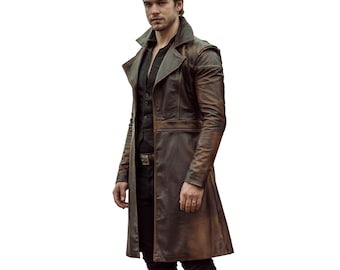 May include: A brown leather coat with a long design. The coat has a notched collar, a button-up vest underneath, and a belt. The coat appears to be made of distressed leather, giving it a vintage look.