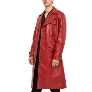 May include: A long red leather trench coat with a button closure and a belt.