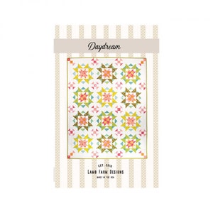 May include: Daydream quilt pattern by Lamb Farm Designs. The pattern features a white background with a repeating star block design in shades of green, yellow, pink, and orange.