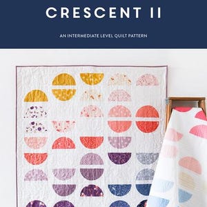 May include: A quilt pattern titled Crescent II by Cotton and Joy Patterns featuring a white background with rows of colorful semi-circle shapes in shades of yellow, pink, red, purple, and blue. The design includes a second quilt draped nearby.