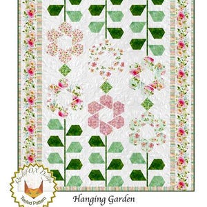 May include: A floral quilt design titled "Hanging Garden" with a white background. The quilt features green and pink floral patterns, with a floral border. The size is 73" x 86". The design is by QuiltFOX Design.