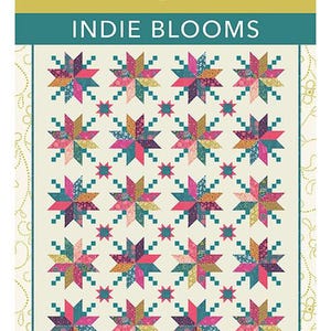 May include: A quilt pattern titled "Indie Blooms" by Crystal Manning. The design features a repeating pattern of colorful starbursts in shades of pink, teal, gold, and purple on a cream background. The quilt size is 60" x 74".