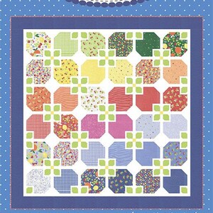 May include: A quilt pattern titled #236 Flower Tiled by Coriander Quilts by Corey Yoder. The design features a grid of octagonal blocks in various floral and gingham prints, separated by small green four-leaf clover shapes on a white background.
